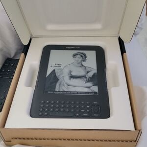Never Used. Amazon Kindle Gray eBook Reader with E-Ink Display